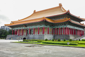 Fototapeta premium The majestic National Theater in Taipei, Taiwan, featuring traditional Chinese architecture with a striking orange-tiled roof and red pillars at Liberty Square.