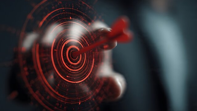 Conceptual hand reaching toward red glowing target symbol floating in dark digital environment representing success precision goal achievement business strategy accuracy focus aim.
