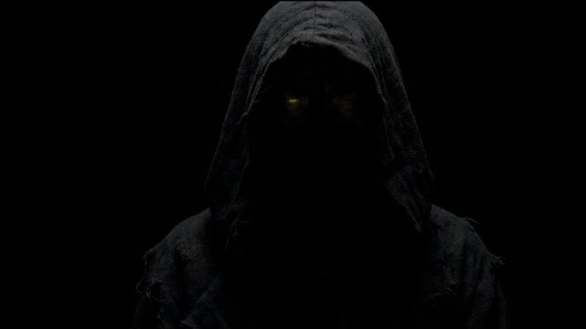 Cinematic 4K Slow Motion of a Creepy Hooded Figure with Glowing Yellow Eyes Staring from Pitch Black Darkness