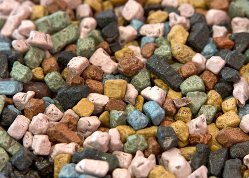 Close up of pile of candy coated chocolates in shape of small rocks. Sweet Treat Background.