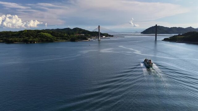 Aerial view following boat toward Iwagi Bridge in Yumeshima Kaido Japan