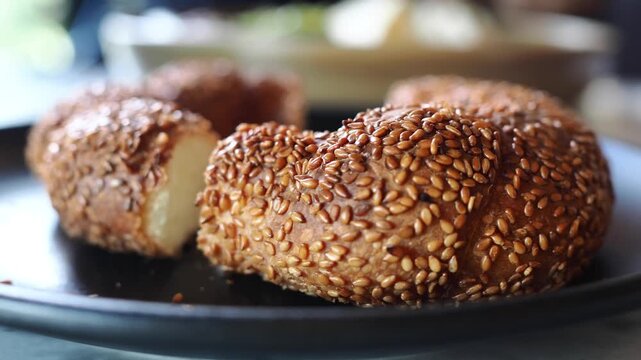 Freshly baked bread with sesame seeds on a plate