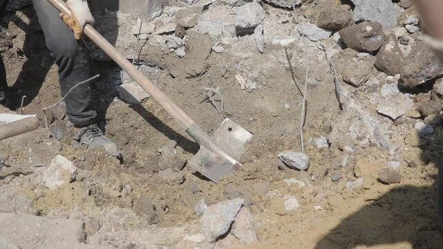 Workers dig in construction area for project