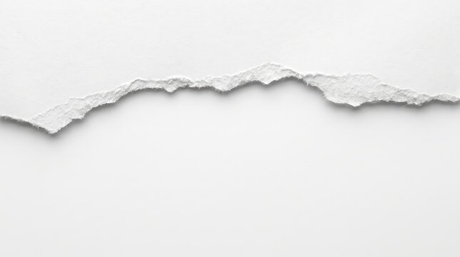 White paper sheet with a horizontal torn edge revealing a blank space underneath against a plain background
