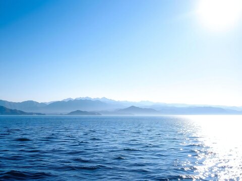 Calm ocean with distant mountains