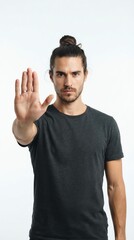 Naklejka premium Young Man with Long Hair and Beard Showing Stop Gesture.