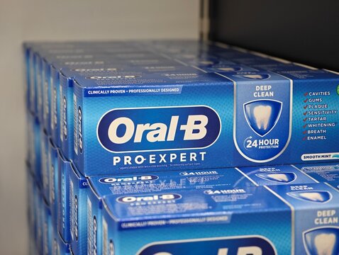 Stockholm, Sweden-Nov.28th 2025: Oral-B Pro-Expert Toothpaste Boxes Stacked on store Shelf