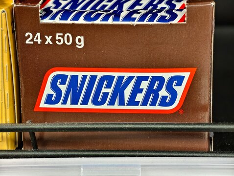 Stockholm, Sweden-Nov.28th 2025: Snickers Chocolate Bar Box on store shelf