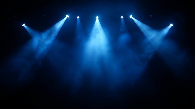 blue stage lights and beams on dark concert stage
