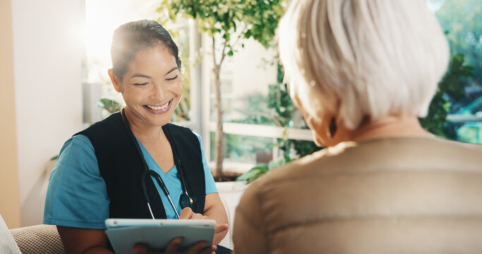 Consultation, tablet and old woman with caregiver for conversation, support or service in nursing home. Homecare, senior person and nurse with healthcare, tech and checkup review in living room