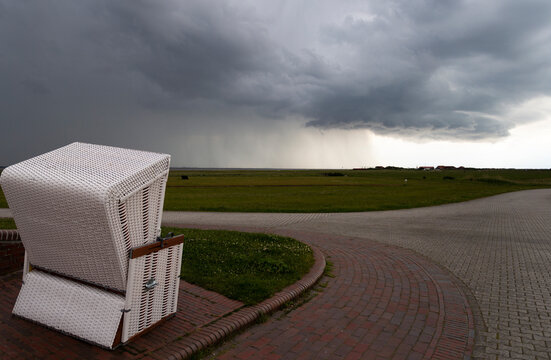 Beach Chair at Dusk with an Approaching Rain Front