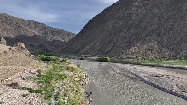 A picturesque landscape featuring the Chilik River in the mountains of the Almaty Region, southeastern Kazakhstan.	