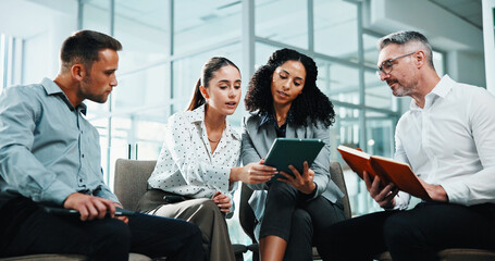 Obraz premium Meeting, tablet and teamwork with business people in office lobby for project management. Collaboration, conversation and employee group with discussion, notes and planning together in workplace