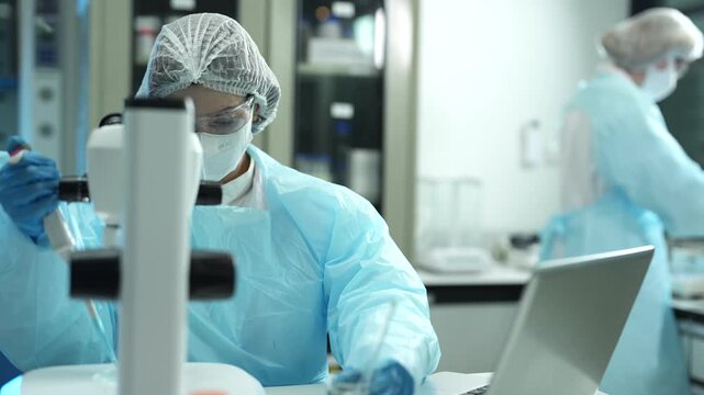 Scientists collaborate in a modern laboratory conducting chemical research, data analysis and experiments, innovation, biotechnology, healthcare and science.