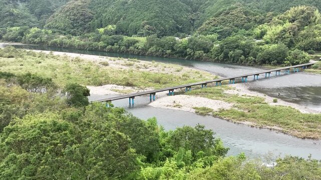 Aerial View of Sada Chinka Bridge over the Shimanto River on a Cloudy Early Summer Morning, Kochi, Japan