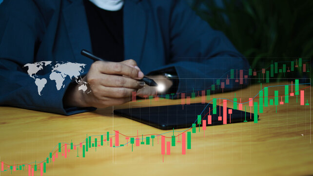 Business professional analyzing global financial market trends on a digital tablet with candlestick chart, stock investment, forex trading, data analytics, fintech, and strategic decision making.
