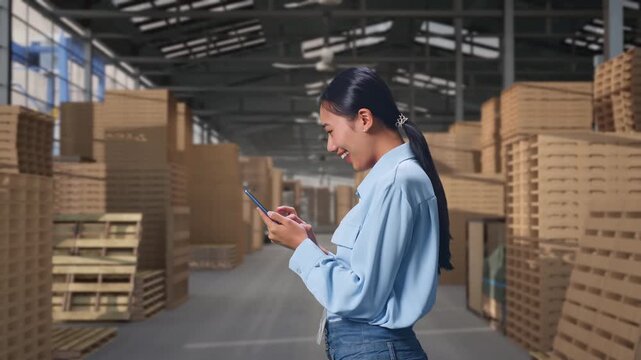 Side View Of Asian Female With Her Smartphone with Stacked Wooden Pallets, Checking On Her Smartphone With Meditation