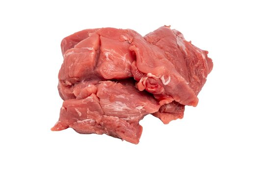 Fresh raw beef chunks on white background for cooking.