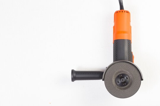 Compact Orange Handheld Grinder Tool for Cutting and Grinding.