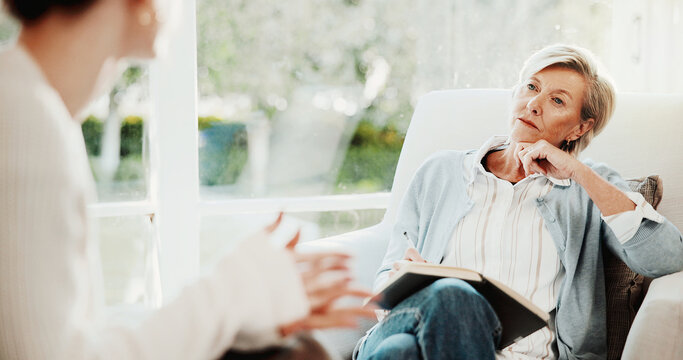 Therapy, psychologist and woman in consultation, listening or writing notes for mental health evaluation. Counseling session, patient and talk with person for assessment, notebook and help in office