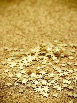 Small gold stars background  with shallow dof and copy space