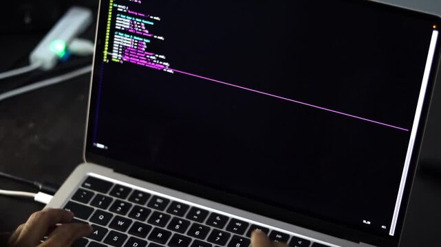 Laptop Displaying Programming Code in Software Development Workspace