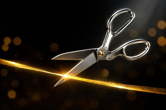 Scissor ribbon cutting ceremony elegant gold metallic opening tool for formal event with dramatic black background