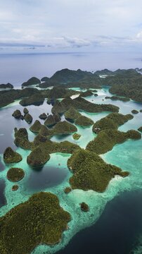 Aerial view of tropical islands and turquoise lagoons, Wayag Archipelagio, West Papua, Indonesia