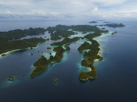 Aerial view of tropical islands and turquoise lagoons, Wayag Archipelagio, West Papua, Indonesia