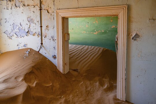Interior view, doors and house full of sand, former diamond mining town, Namib Desert, Kolmanskop, Karas, Namibia