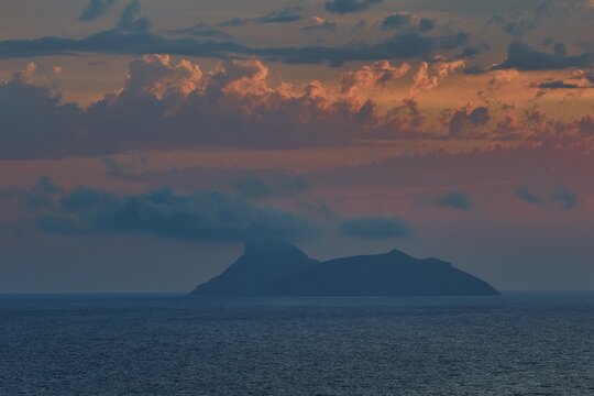 Paximadia island, island surrounded by clouds, dusk at sea, Matala, South Coast, Crete, Greek Islands, Greece