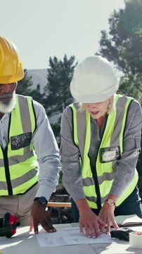 Discussion, team and engineer with floor plan outdoor for construction, site development and project. Collaboration, architect and mature people with blueprint document, point and review design