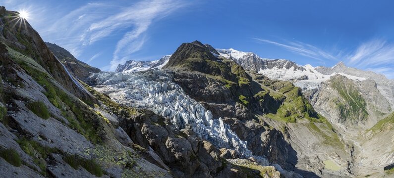 Mountain panorama, picturesque high alpine mountain landscape with Lower Arctic Sea glacier and Grindelwald-Fiescherfirn glacier, sun star, hiking to Schreckhornh&uuml;tte, Bernese Oberland, Switzerland