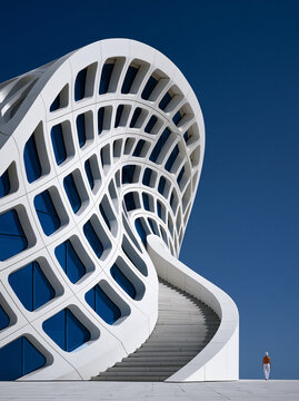 A close-up shot of a wind turbine blade, highlighting the intricate design of alternative energy technology. The composition includes enough copy space for messaging.