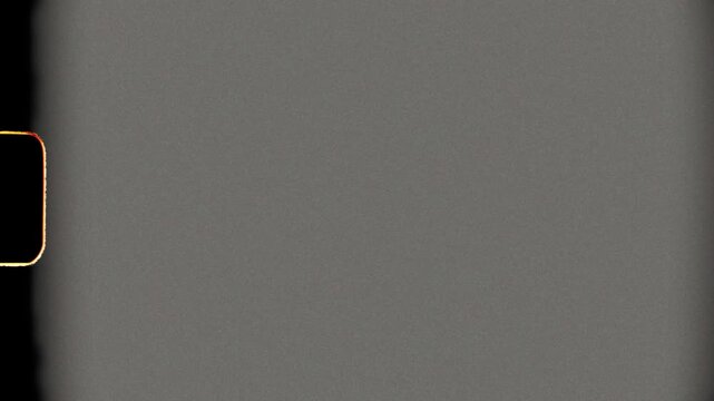 Retro 8mm Film Frame Background Loop with Vintage Grain and Flicker Overlay