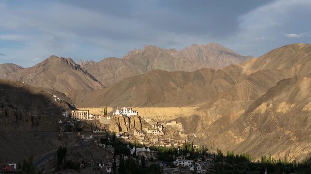 Lamayuru, India: Time lapse of the sunset over the village and famous Tibetan Buddhism Lamayuru monastery or Yuru Gompa in Ladakh Himalayan mountains in India. Shot with a zoom out effect