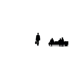 Obraz premium Businessman walks past a group of seated people who are waiting in a modern public terminal area.