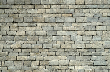 Fototapeta premium Gray chiseled stone block wall masonry texture background