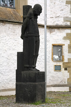 Osnabruck, Germany. The Bound Man sculpture, a memorial to the victims of truth and freedom. The sculpture by sculptor Gerhard Marcks was unveiled on July 20, 1964 in front of the Dominican Church.