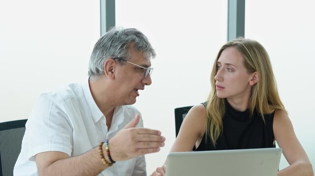 Caucasian businessman and business woman working  in the office