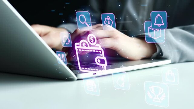 A person types on a laptop while digital wallet icons hover above the screen. The setting is likely a home or office. The activity shows online payment processing.
