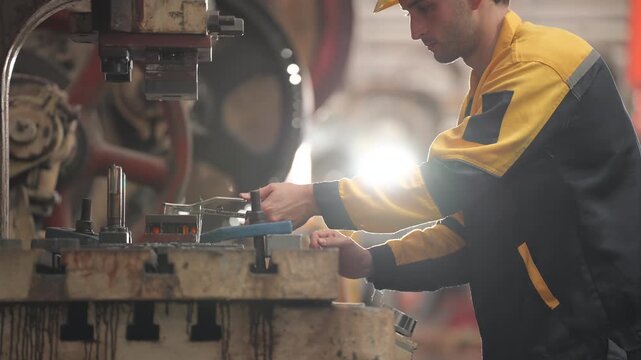 Engineers, technicians, and factory production staff analyze manufacturing systems, inspecting equipment, discussing repair procedures, improving operational performance, preventing mechanical breakdo