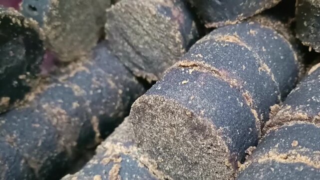 Macro shot of organic palm sugar jaggery blocks used as a natural sweetener in Asian cooking.