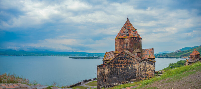 Ancient Sevanavank monastery against Lake Sevan in Armenia with copy space