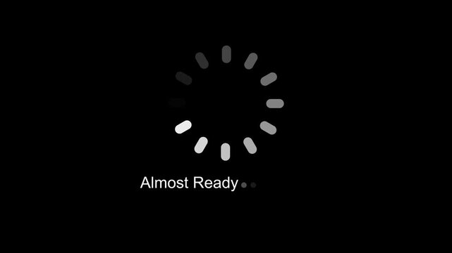Almost Ready Text Status Animation with Circular Progress Spinner UI Preloader Interface Graphic Element Seamless Loop Video on Black Background for Software Startup and Web UX Design.