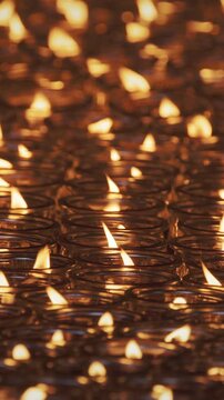 Chengdu, Sichuan, China. Close-up View Of Burning Red Candles In Glass. Religious Ritual In Temple. Many Oil Lamps Burning At Wenshu Monastery Buddhist Temple. Many Lit Candles In Buddhist Temple