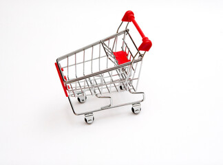 Concept image for shopping. Shopping cart on a white background. © Jne Valokuvaus
