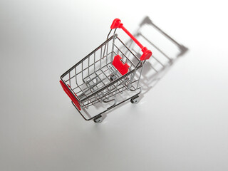 Concept image for shopping. Shopping cart on a white background. © Jne Valokuvaus