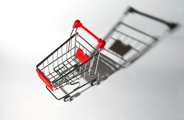 Concept image for shopping. Shopping cart on a white background. © Jne Valokuvaus