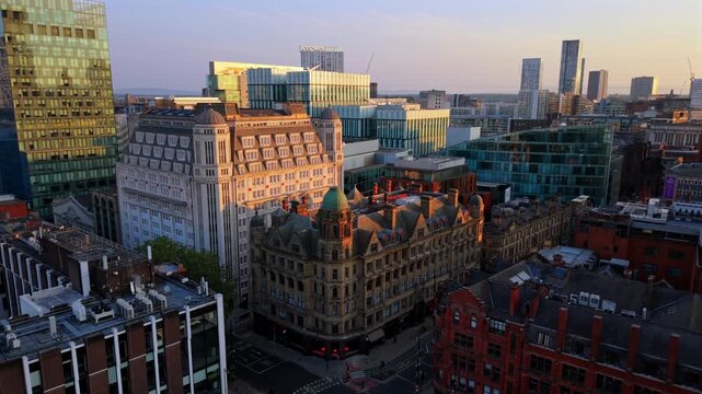 Aerial Video of Deansgate, Spinningfields, and Manchester City Centre Architecture at Sunrise